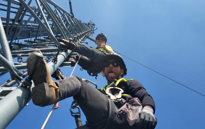 One Way Wireless Construction's Luke & Simeon climb a tower in Fairmont, MN